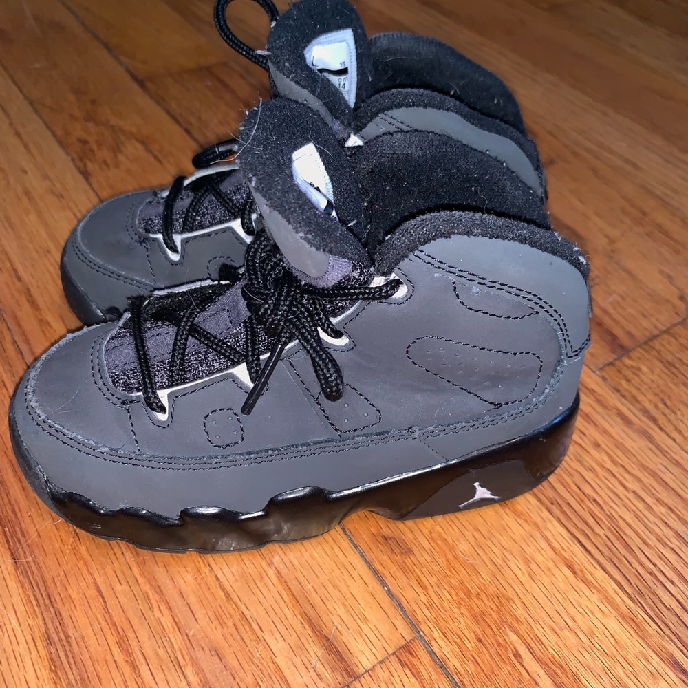 Jordan’s size 9 black suede sneakers